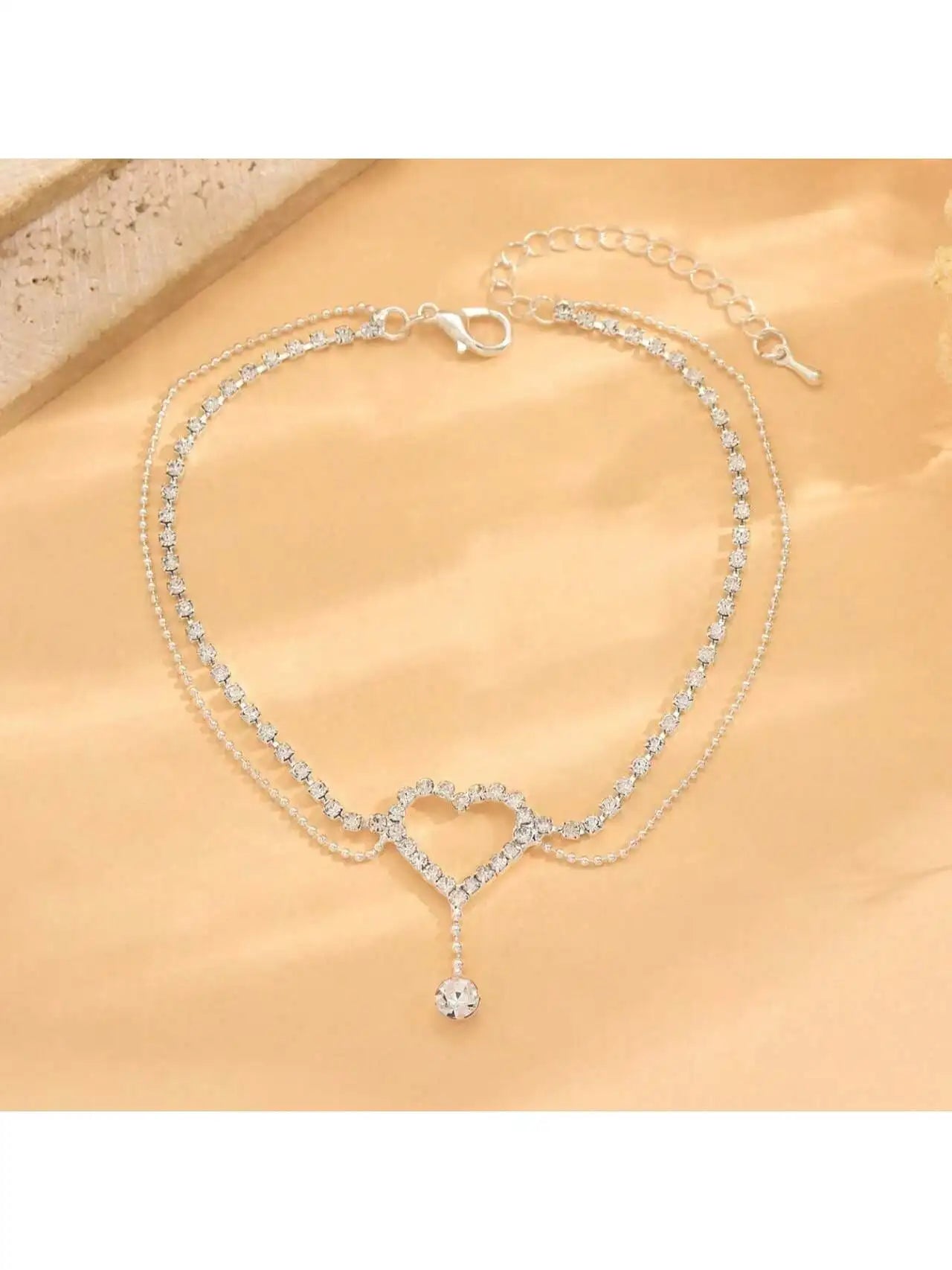 Exquisite and fashionable sparkling micro inlaid rhinestone hollow out love droplet pendant anklet suitable for parties