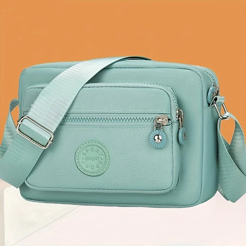 Neutral style handbag made of lightweight and simple nylon fabric, new single-shoulder women's bag. [The zipper direction is ran